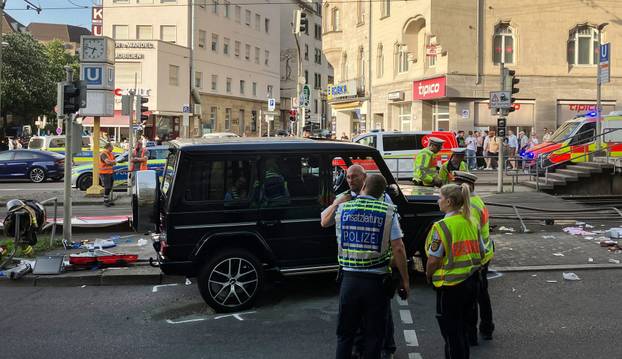 Car drives into group of people